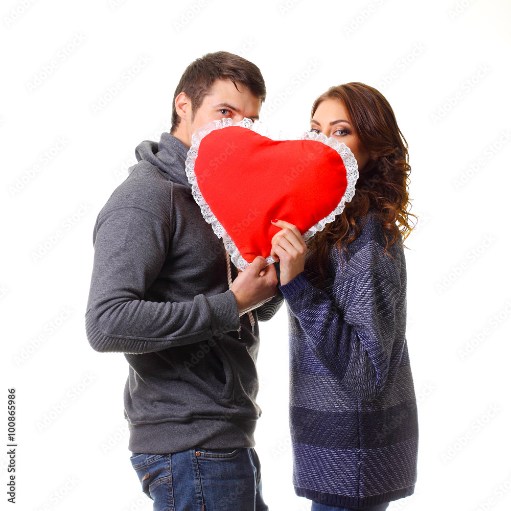 Usual couple hid behind the heart and kiss. Usual couple hid behind the heart and kiss.