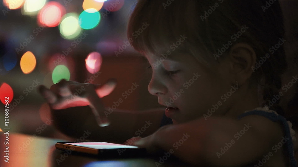 Little Girl viewing Photos on Smartphone Little Girl viewing Photos on Smartphone
