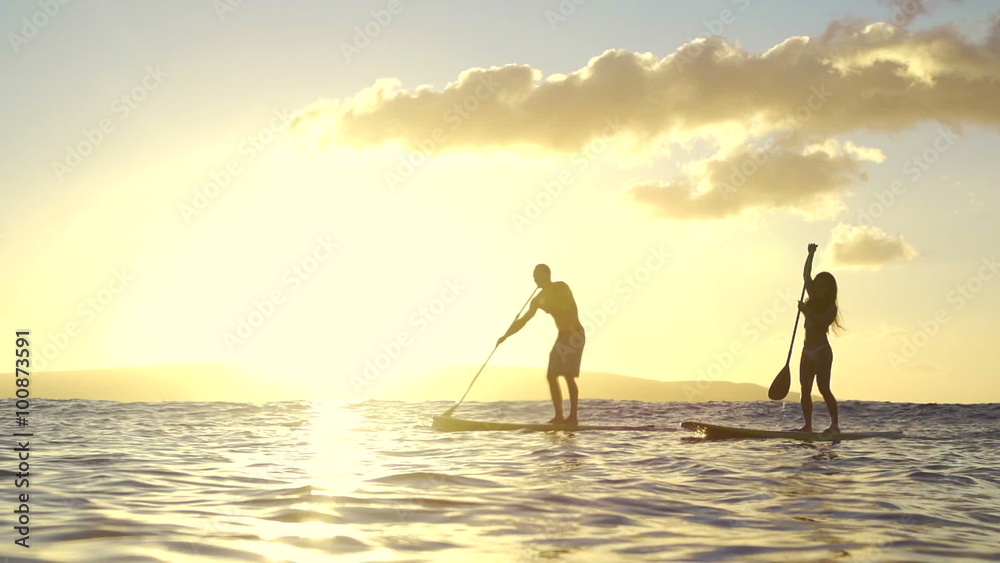Slow Motion Silhouette Happy Couple Stand Up Paddling Boarding In Ocean 
