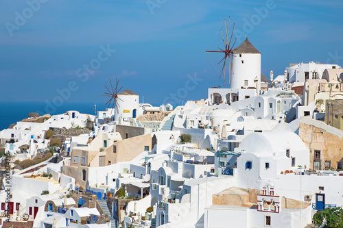 SANTORINI, GREECE - OCTOBER 5, 2015: The look to part of Oia with the windmills.
