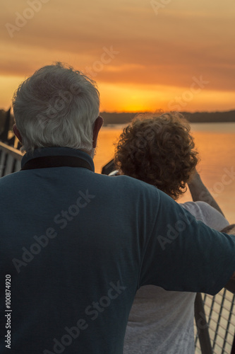 older couple watching sunset