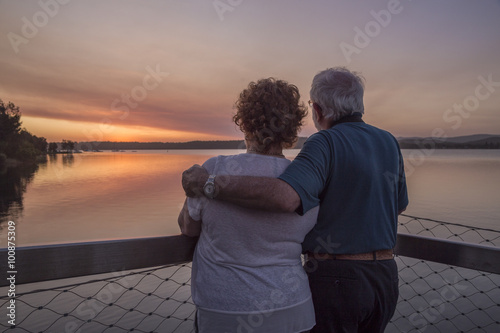 older couple watching sunset