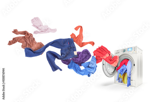 Принти на полотні Colored laundry flying from washing machine, isolated on white b