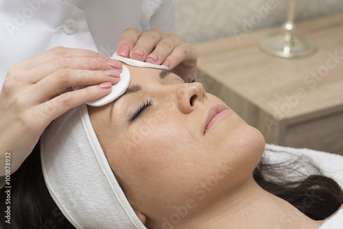 Face of calm female during procedure of facial massage