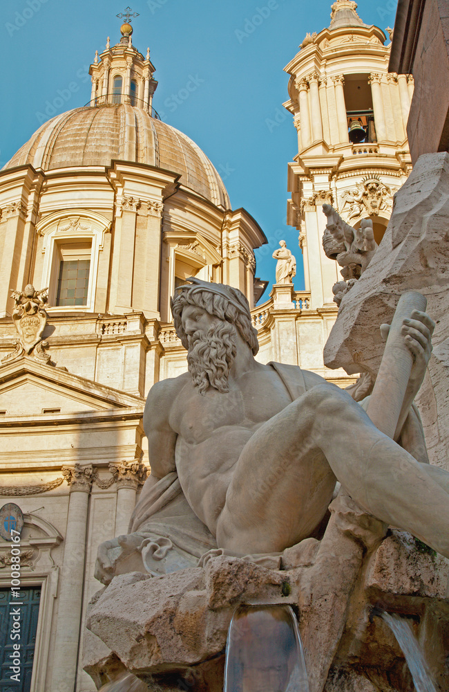 Rome - Piazza Navona in morning and Fontana dei Fiumi by Bernini and Santa Agnese in Agone church