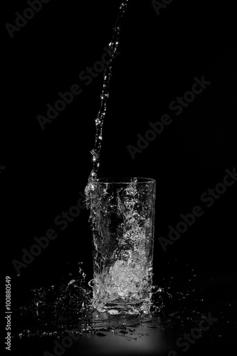 water is poured into a glass