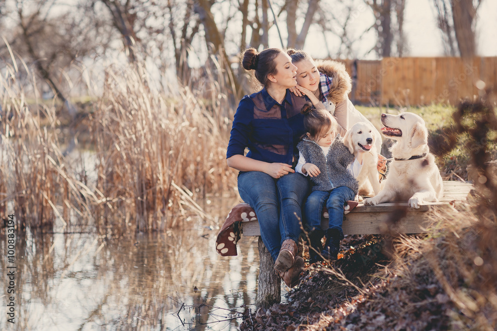 Happy family with Pets near the lake