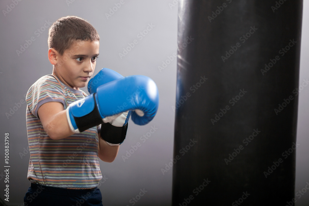 young child with boxing gloves