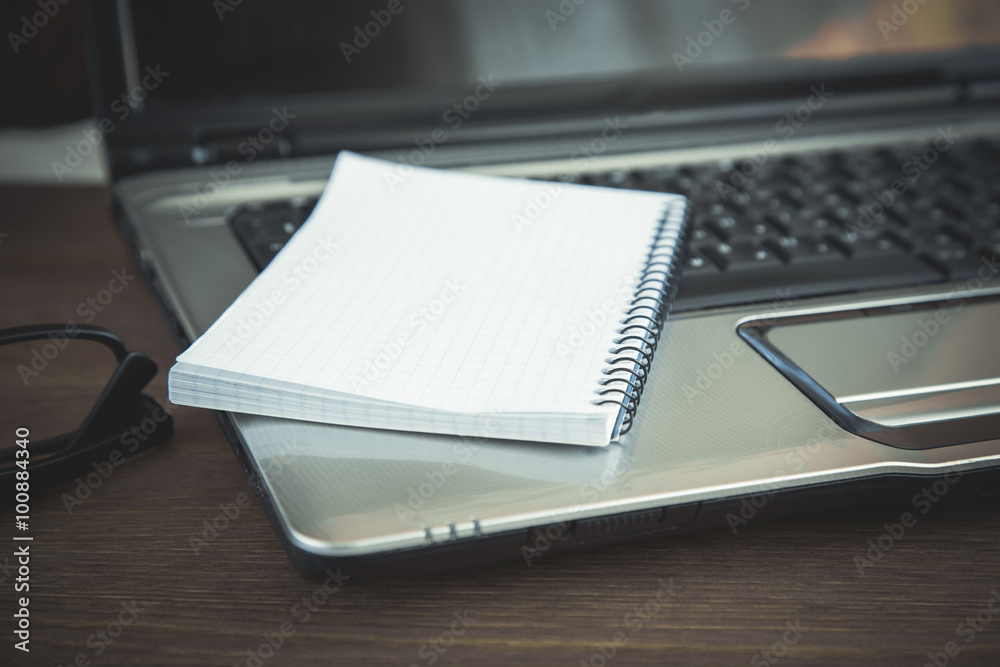 Office supplies at wooden table, toned Office supplies at wooden table, toned