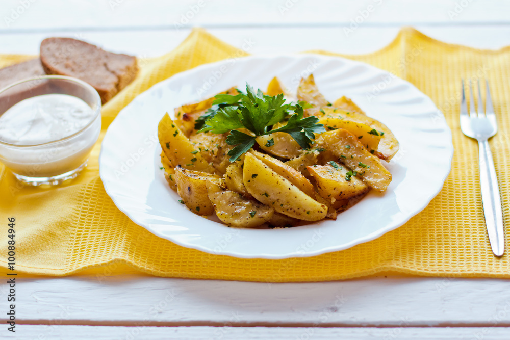 beautiful roasted potatoes with herbs and spices on a white plate beautiful roasted potatoes with herbs and spices on a white plate