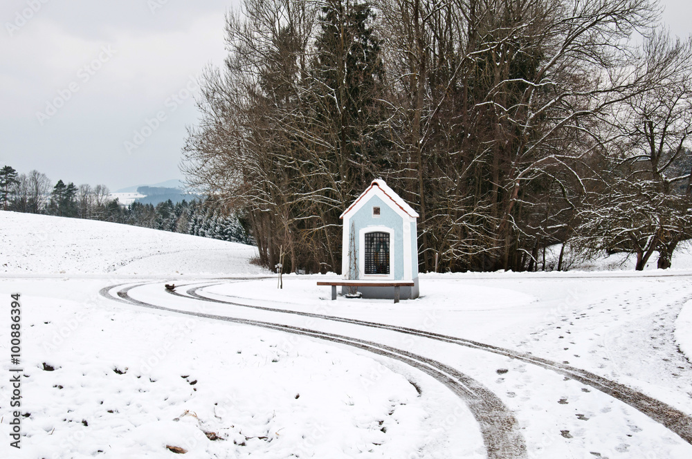 chapel in a rural landscape in winter chapel in a rural landscape in winter
