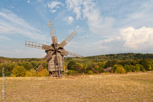 Ancient wooden windmill in a meadow. Ukraine, Pirogovo