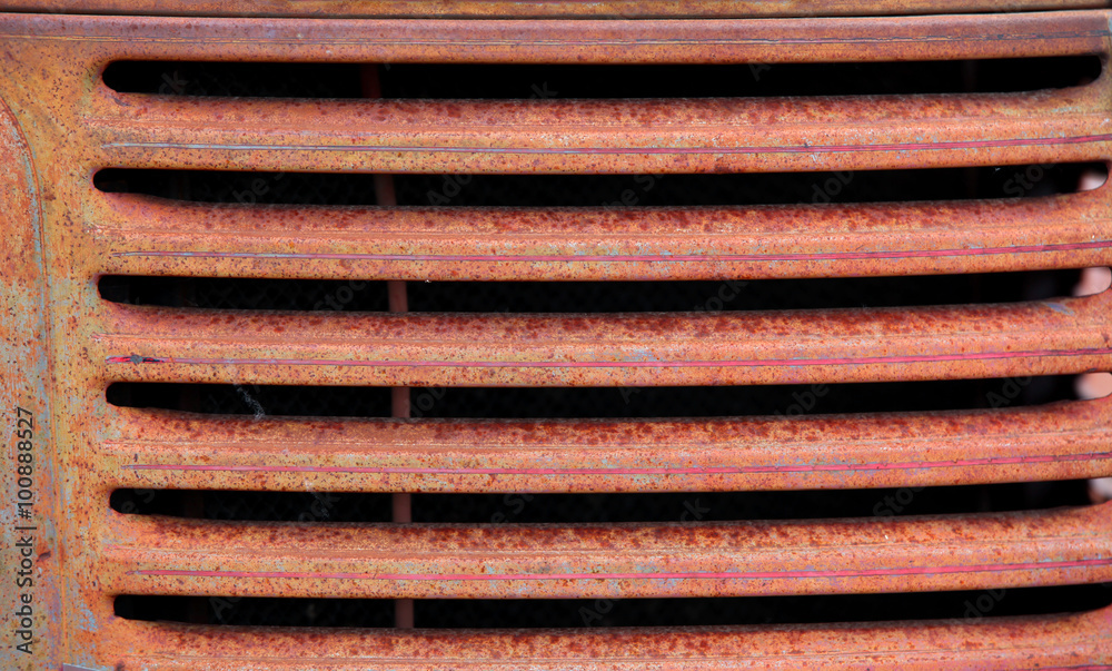 Rusty old truck grill background