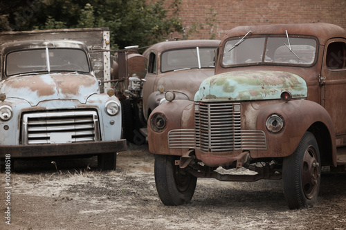 Old rusty abandoned trucks in the yard