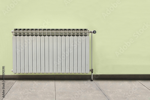 Wallpaper Mural Gray radiator on a yellow wall Torontodigital.ca