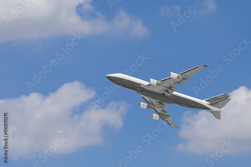 Boeing 747-400 airplane againt blue sky