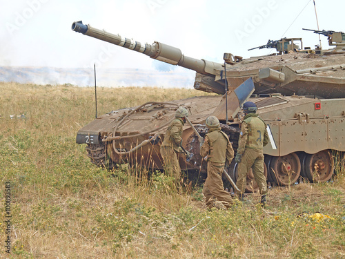 Merkava tanks and Israeli soldiers in training armored forces