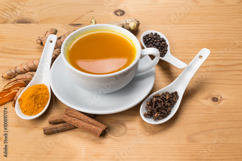 Aromatic turmeric tea with black pepper, cinnamon, cloves and ginger offers many wellness health benefits