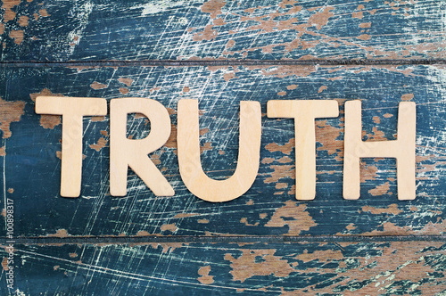 Word truth written with wooden letters on rustic surface
