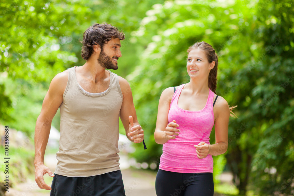 Fototapeta premium Couple running in a park