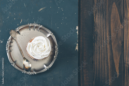 Cup cake on the rustic table.