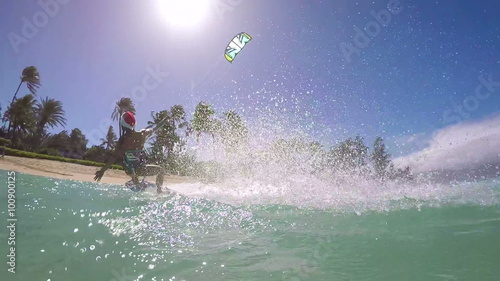 Woman Kite Surfing In Santa Claus Hat 