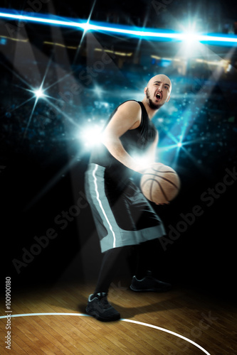 Basketball player throws a ball in the game © ponomarencko