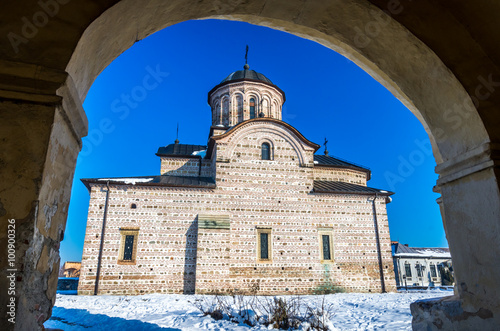Curtea de Arges town, Romania. The Royal Court Church of Wallachia in winter. Curtea Domneasca. photo