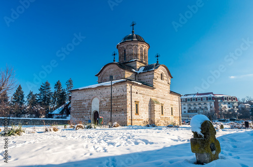 Curtea de Arges town, Romania. The Royal Court Church of Wallachia in winter. Curtea Domneasca. photo