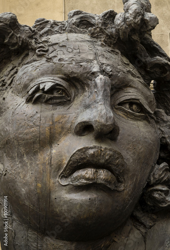  Bronze street art - woman sculpture. © elephotos