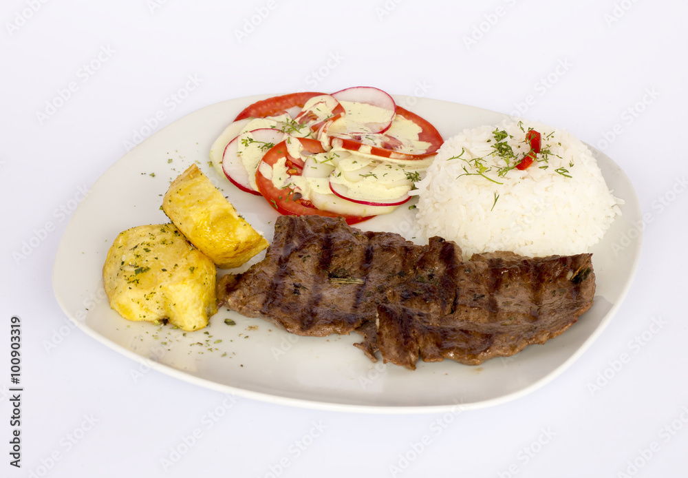 Grilled beef fillet assorted peruvian dish, rice, potatoes, tomatoes, 