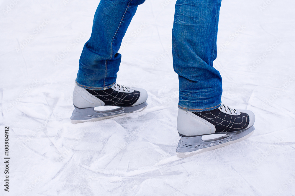 Man ice skating. winter outdoors on ice rink. Man ice skating. winter outdoors on ice rink.