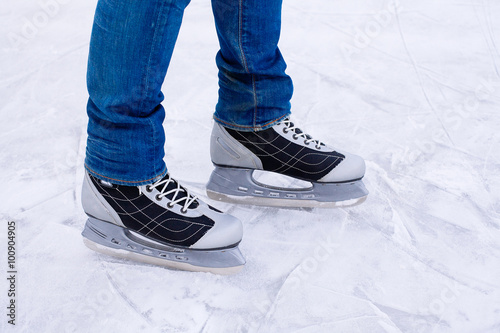 Man ice skating. winter outdoors on ice rink.