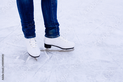 Woman ice skating. winter outdoors on ice rink.