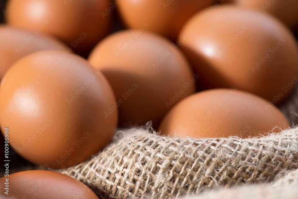 Chicken eggs lying on sackcloth Chicken eggs lying on sackcloth