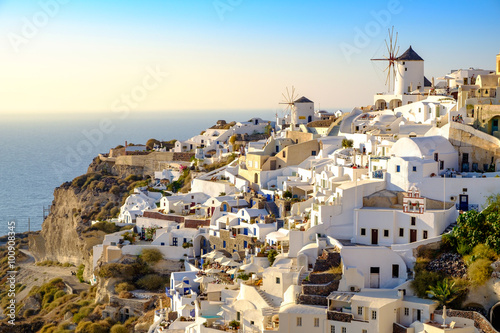 View of beautiful village of Oia with whitewashed and colorful h