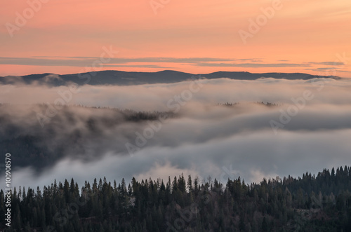 Carpathian mountains in the clouds, sunrise seen from Wysoka mountain in Pieniny, Poland