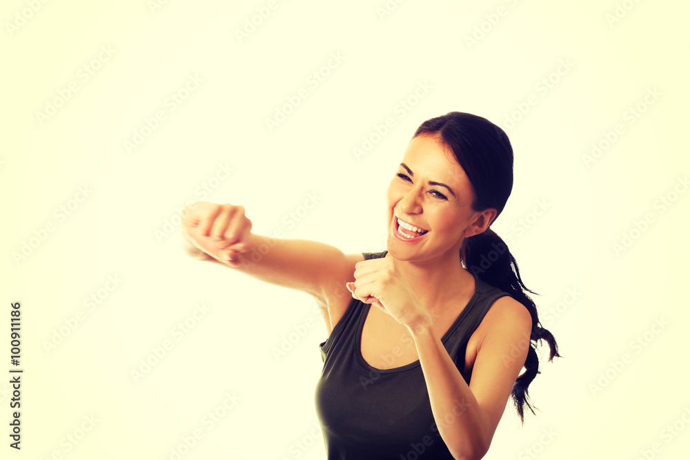 Woman in military clothes boxing to the camera Woman in military clothes boxing to the camera
