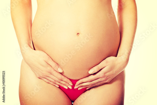 Wallpaper Mural Pregnant woman touching belly Torontodigital.ca