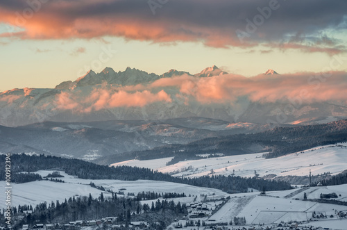 Morning panorama of snowyTatra Mountains over Spisz Highland, Poland