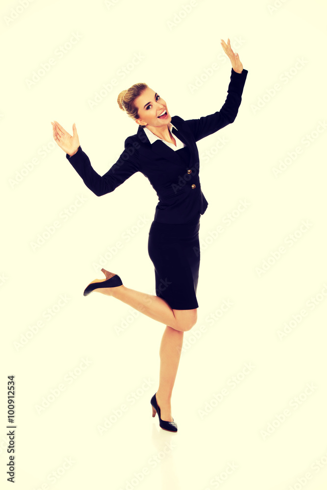 Young happy jumping businesswoman