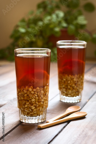 Traditional Chilean non-alcoholic cold drink called Mote (cooked husked wheat) con Huesillo (dried peach) (Selective Focus, Focus on the first drink)