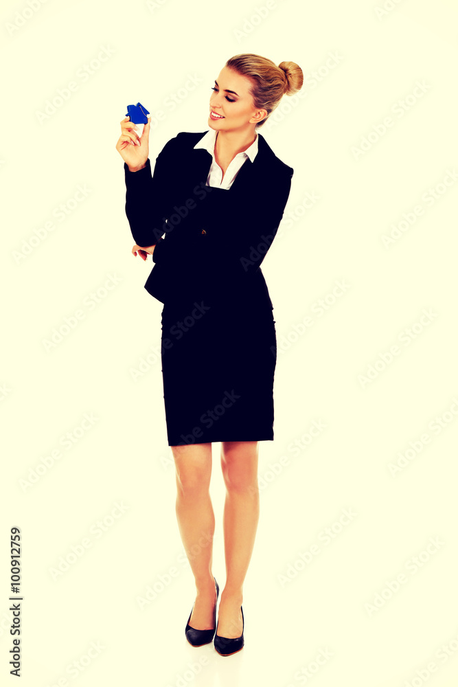Businesswoman real estate agent with house pendant Businesswoman real estate agent with house pendant