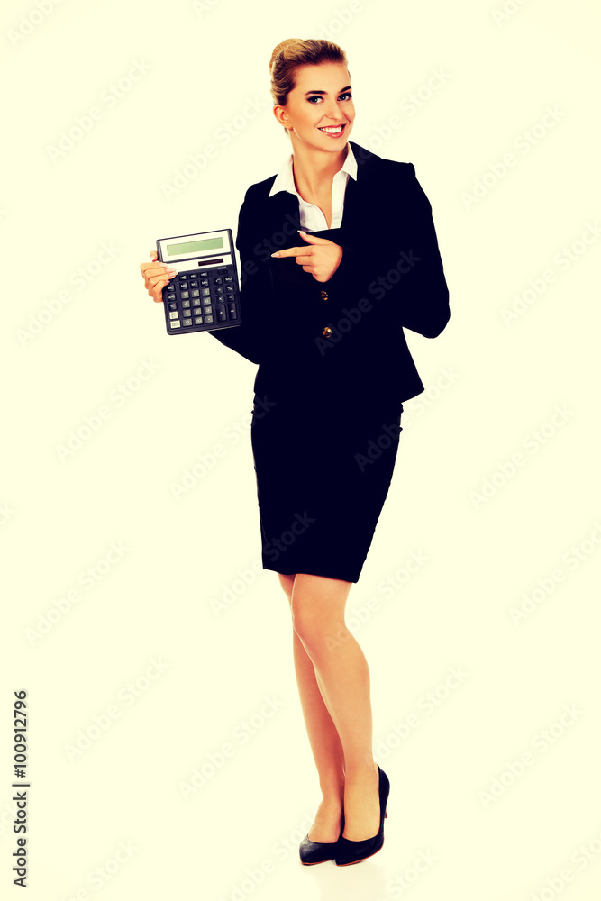 Happy businesswoman holding a calculator Happy businesswoman holding a calculator