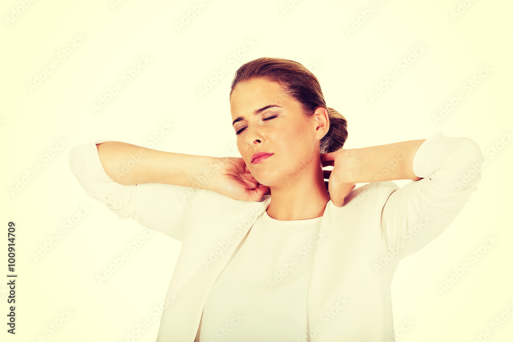 Businesswoman having huge neck pain Businesswoman having huge neck pain