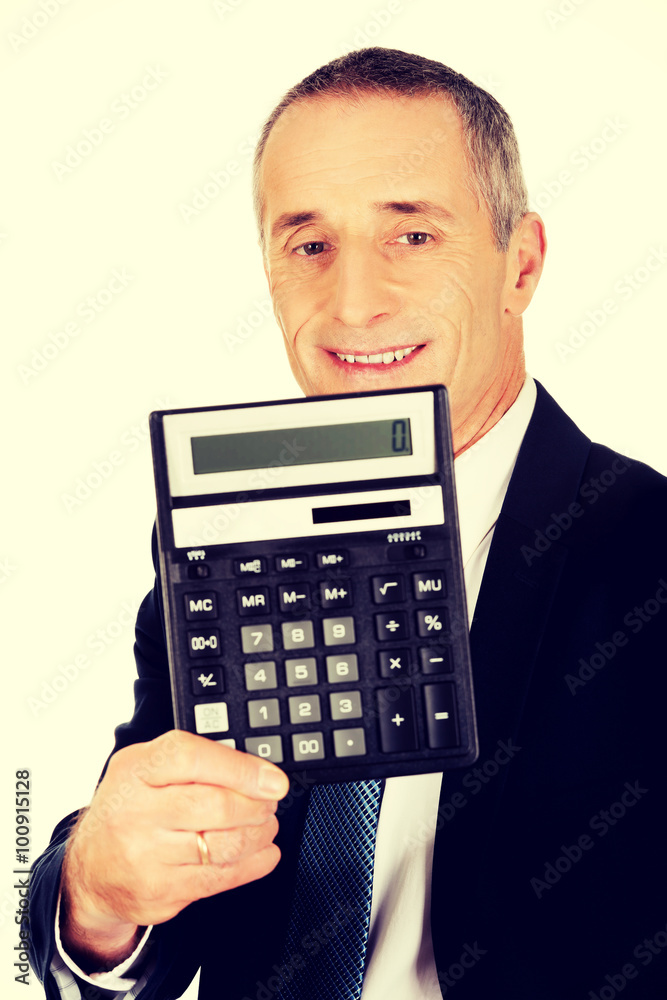 Happy businessman holding a calculator Happy businessman holding a calculator