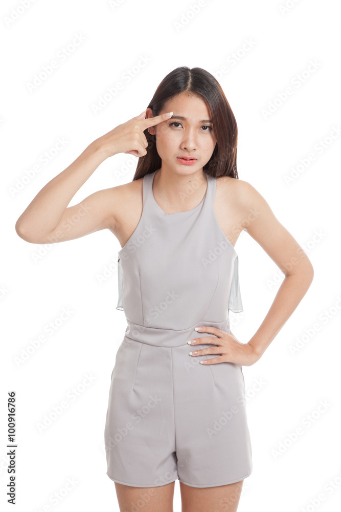 Beautiful young Asian woman thinking point to her head Beautiful young Asian woman thinking point to her head