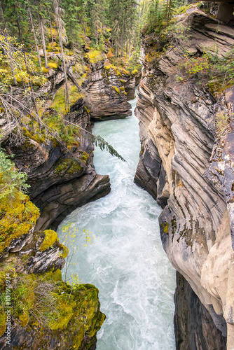 water of river in the middle of a gorge in the rocky mountains of alberta canada