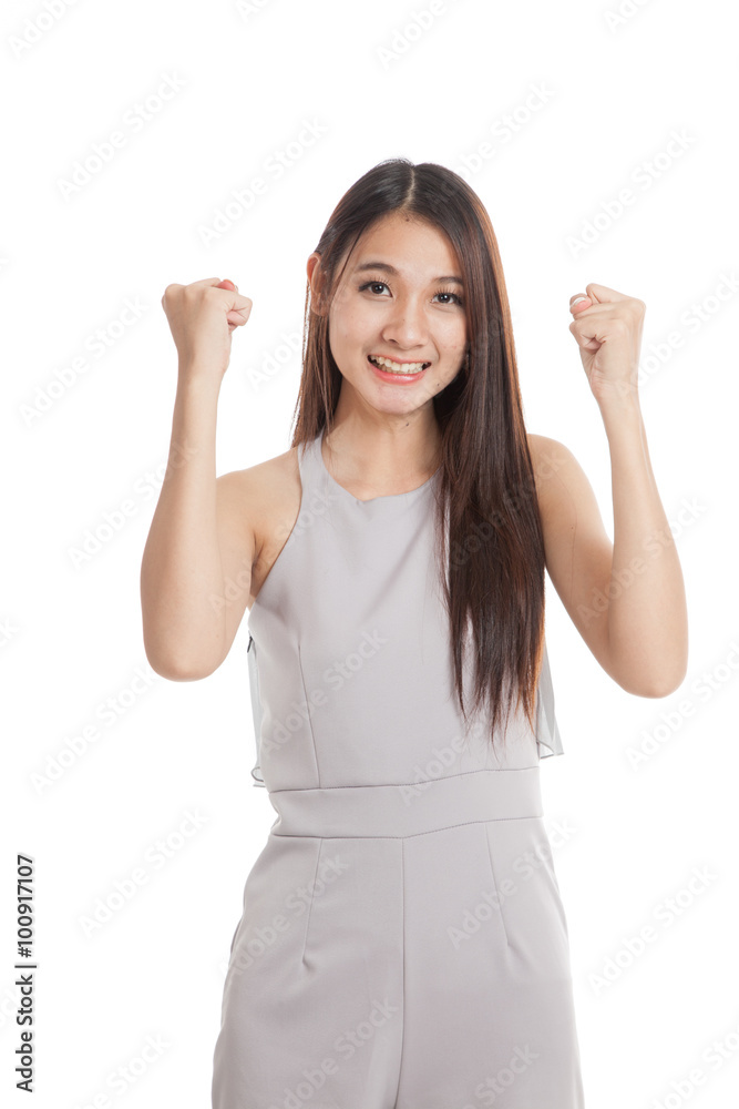 Successful young Asian woman hold fist up Successful young Asian woman hold fist up