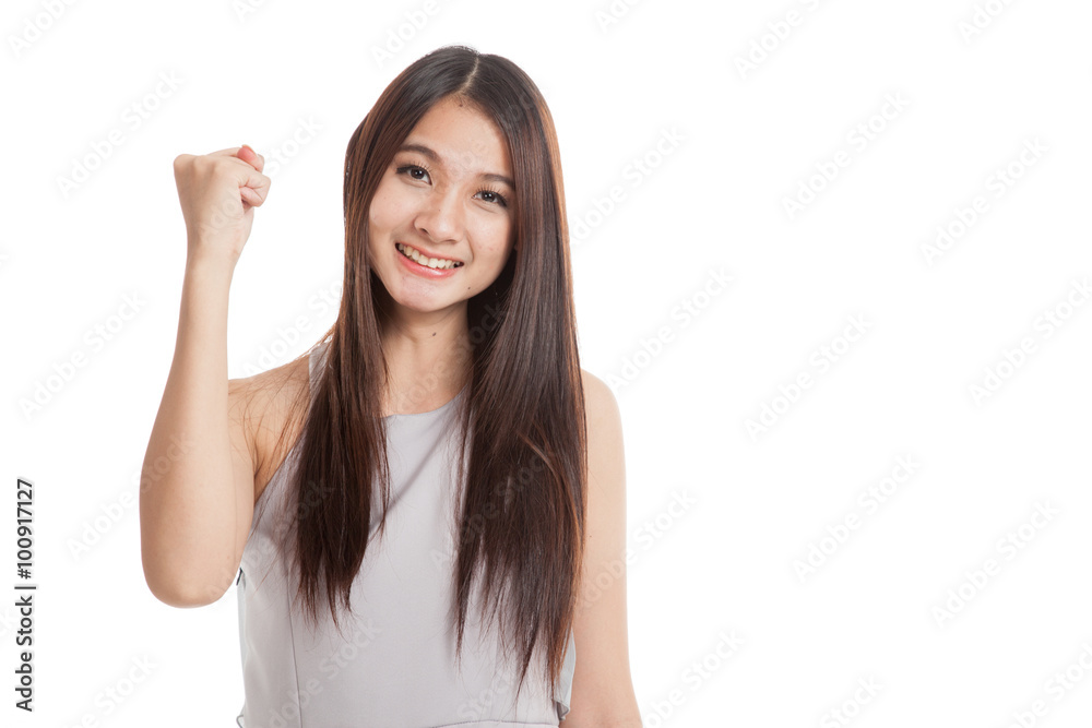 Successful young Asian woman hold fist up Successful young Asian woman hold fist up